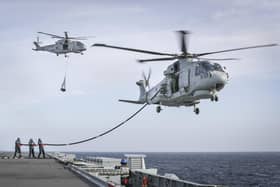 A contract to build engines for Royal Navy helicopters has been agreed, bringing high-skilled jobs to Fareham. Pictured: Merlin Mk2 helicopters of 820 Naval Air Squadron conduct Helicopter In Flight Fuelling (HIFR) and Vertical Replenishment (Vertrep) onboard HMS Queen Elizabeth in 2021.