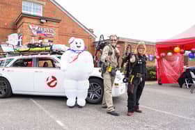 People dressed up as ghost busters with the ghostbusters mobil at Comic Con in Gosport.