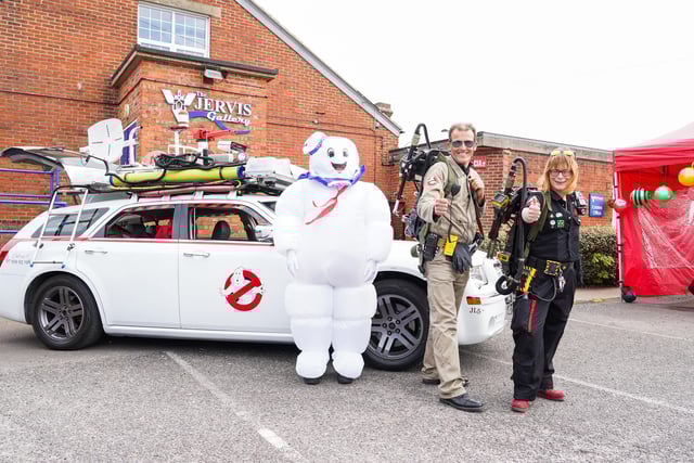 People dressed up as ghost busters with the ghostbusters mobil at Comic Con in Gosport.