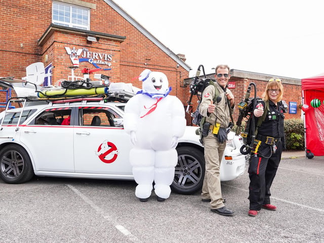People dressed up as ghost busters with the ghostbusters mobil at Comic Con in Gosport.