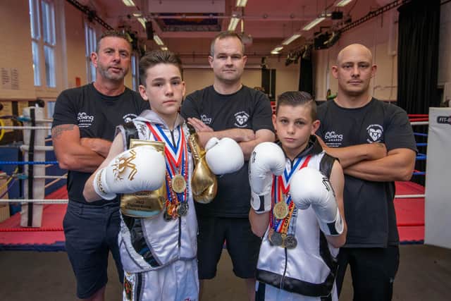 Heart of Portsmouth's English Schools champions Alfie Holman, left, and Charlie Keet. Also pictured are coaches George Smith, David Johnston and Jimmy Smith.
Picture: Habibur Rahman