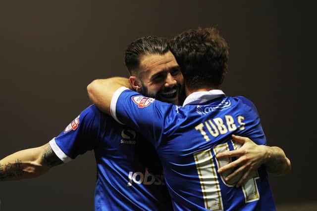 James Dunne celebrates with Matt Tubbs after the striker netted in Pompey's 2-2 draw with Cheltenham in March 2015. Picture: Joe Pepler