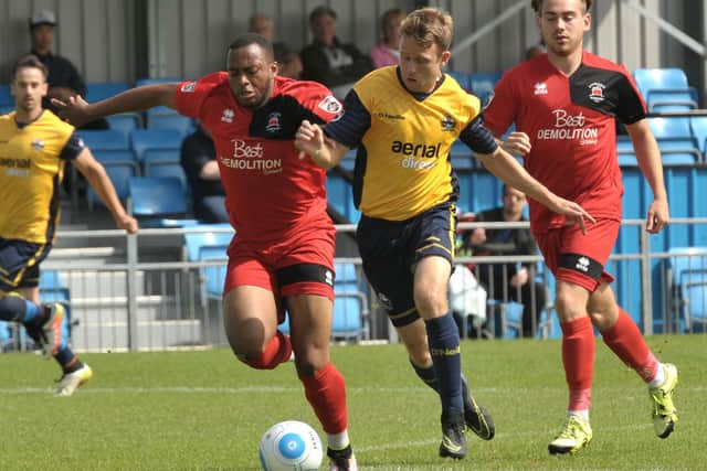 Warren Bentley (yellow, right) in action for Gosport Borough in 2016.