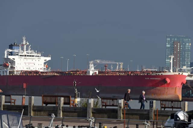 Pictured: The Hythe Ferry passes in front of the Nave Andromeda at berth in Port of Southampton this morning, following the major incident off the east coast of the Isle of Wight after 7 stowaways were detained from the vessel after a reported hijacking. Photo: Simon Czapp/Solent News & Photo Agency
