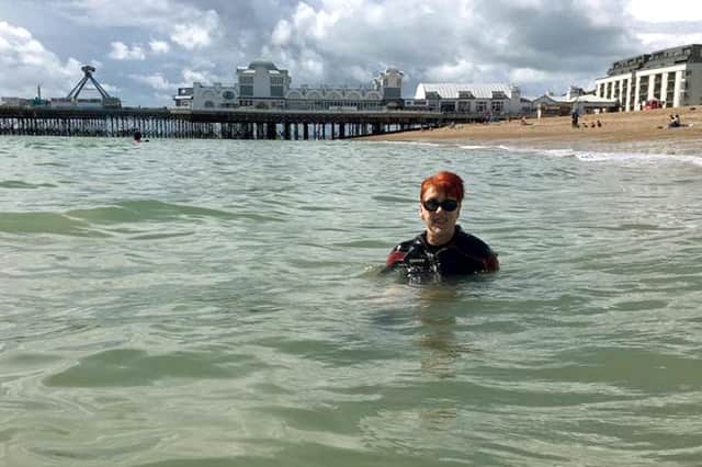 Laura Collinson from Eastney was able to go in the sea at Southsea for the first time in 25 years after the Accessible Beach Campaign For Pompey cleared away some shingle. Picture: Jonathan Schofield