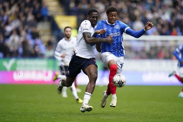 Substitute Kusini Yengi battles with Ricardo Santos in Pompey's 1-1 draw at Bolton. Picture: Jason Brown/ProSportsImages