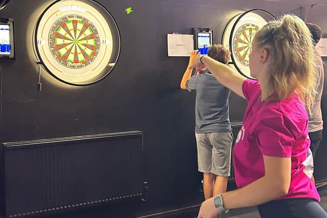 Younger Hub Helper Lottie joined in with the Darts Tournament last year.