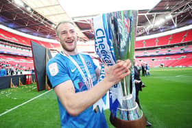 Matt Clarke in happier times when celebrating winning the Checkatrade Trophy with Pompey in March 2019. Picture: Joe Pepler