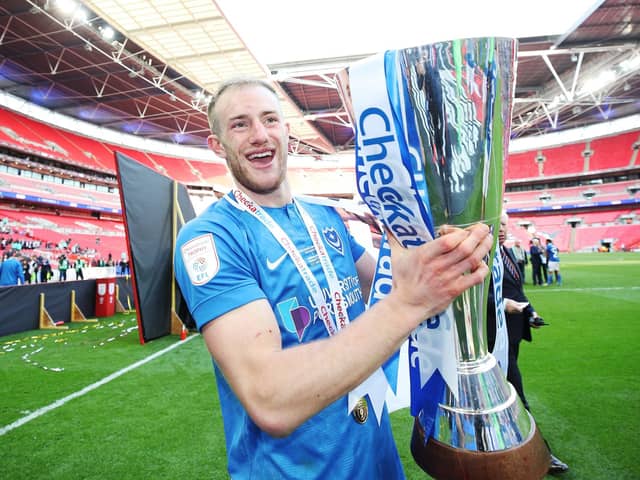 Matt Clarke in happier times when celebrating winning the Checkatrade Trophy with Pompey in March 2019. Picture: Joe Pepler