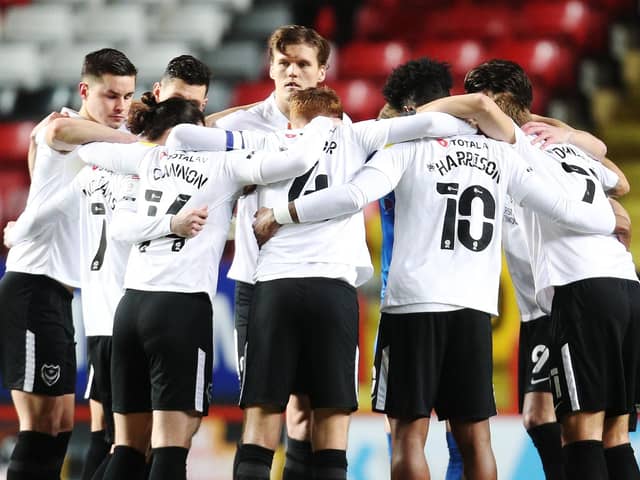 Pompey players huddle. Picture: Joe Pepler