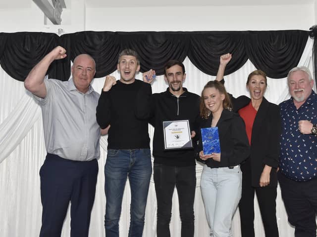 Sarah Willett (second from right) from Gosport Borough Council with the winners of the Best use of Heritage in Business award, Powder Monkey Brewery.Picture: Sarah Standing (230524-2913)