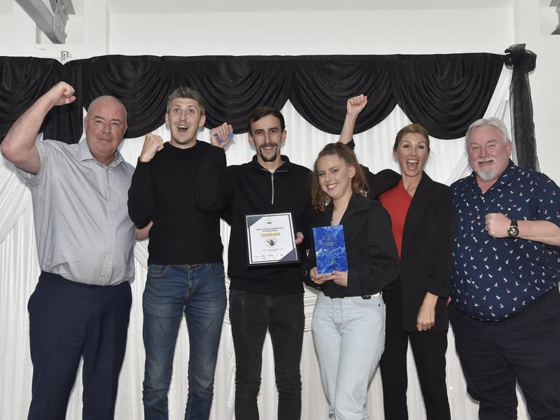 Sarah Willett (second from right) from Gosport Borough Council with the winners of the Best use of Heritage in Business award, Powder Monkey Brewery.Picture: Sarah Standing (230524-2913)