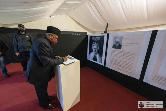 Picture issued by the Ahmadiyya Muslim Youth Association UK of their National President Rafiq Ahmed Hayat, signing a book of condolence in Kingsley, following the death of Queen Elizabeth II Picture:  Ahmadiyya Muslim Youth Association UK/PA Wire