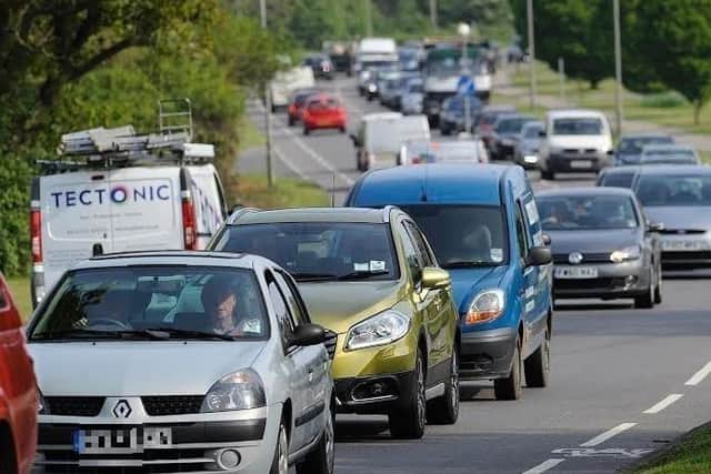Drivers are delayed following a two-car crash.