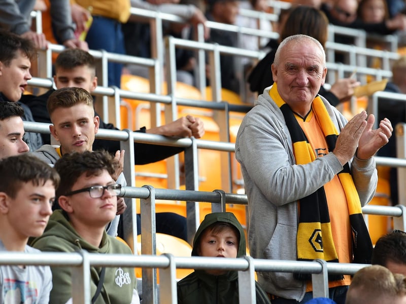 Fans wait in seats with built-in safety barriers, known as rail seating, to allow safe standing, ahead of the English Premier League football match between Wolverhampton Wanderers and Manchester United at the Molineux stadium in Wolverhampton, central England on August 19, 2019. ( PAUL ELLIS/AFP via Getty Images)
