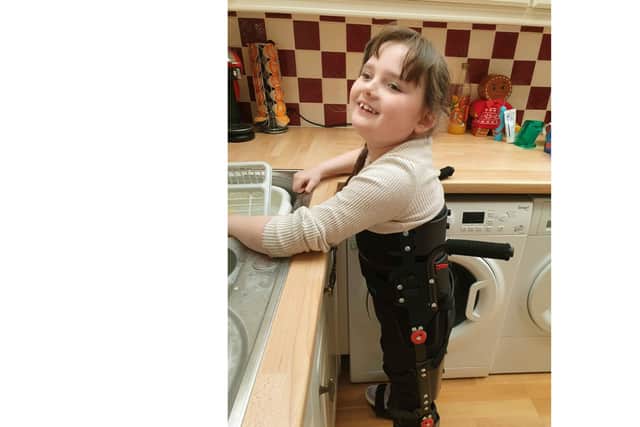 Lana Brown, from Stubbington, who has cerebral palsy and needs an operation to be able to walk, pictured in a brace donated by the Eight Foundation.