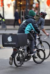 A Deliveroo cycle rider. Pic: PA