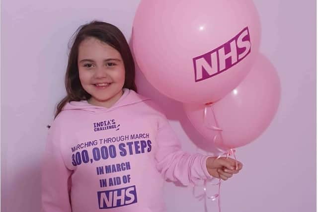 India-Rose Jenkins from Hilsea has walked 300,000 steps in March for the children's ward at Queen Alexandra Hospital. Pictured: India-Rose in her specially-made jumper for the event
