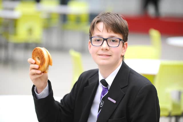 Representatives from the FatFace Foundation attended Havant Academy's daily breakfast club to celebrate its donation of £30,000 to the Magic Breakfast. The charity's contribution will pay for 100,000 breakfasts for schoolchildren across the nation who arrive at school too hungry to learn - starting in Havant. Pictured is: Ollie Hunt, 14, who is in Year 10. Picture: Sarah Standing (280220-6208)
