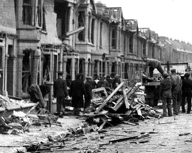 Clearing up. Newcomen Road, Stamshaw, after a flying bomb fell on July 15, 1944 - the last bomb to fall on Portsmouth. Picture: The News.