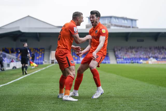 John Marquis rushes to congratulate Lee Brown following his second goal.
