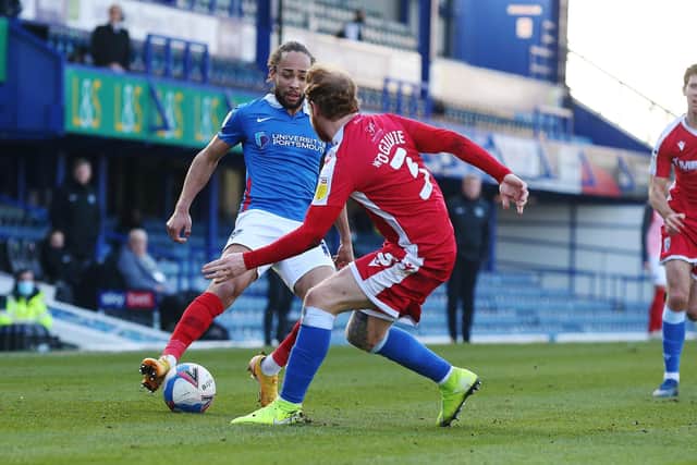 Marcus Harness beating Connor Ogilvie on his way to setting up Sean Raggett for Pompey's opener. Gaffer for a Day Lee Laver believes the winger deserves man of the match for that moment of quality. Picture: Joe Pepler