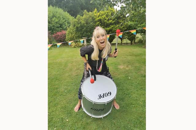 Jo Harvey drumming in her garden