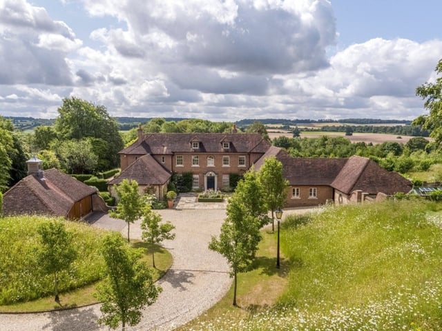 This Hampshire home has seven bedrooms, five bathrooms and four reception rooms and it comes with a swimming pool.