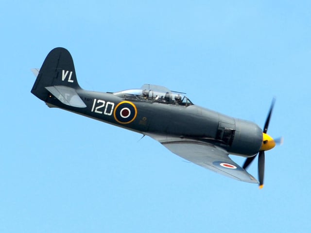 HMS Edinburgh returns to Portsmouth for the last time before she is decommissioned. A Sea Fury fly past Picture: Paul Jacobs  (131468-2)