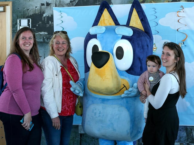 From left, Lisa McGuigan, Jackie Ginn, and Kayleigh Hibberd with her daughter, Maeve, 9 months, meet Bluey at the Spinnaker Tower Picture: Chris Moorhouse (290524-35)