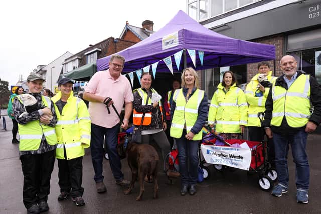 John Hughes, in pink shirt, has just made a cash donation to the group. Voluntary litter picking group Trash Busters at a fundraising day in Waterlooville
Picture: Chris Moorhouse