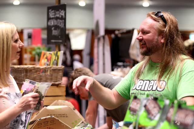 Photo from a previous Vegan Festival. Wendy Brown listens to Damain Eadie of Benevo vegan pet foods. Portsmouth Vegan Festival 2019, Portsmouth Guildhall.          
Picture: Chris Moorhouse