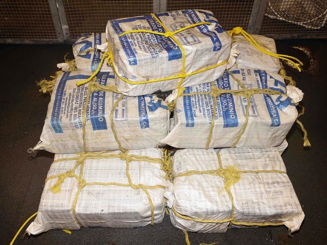 HMS Dauntless recovers bales of narcotics during a counter-interdiction operation in the Caribbean Sea.