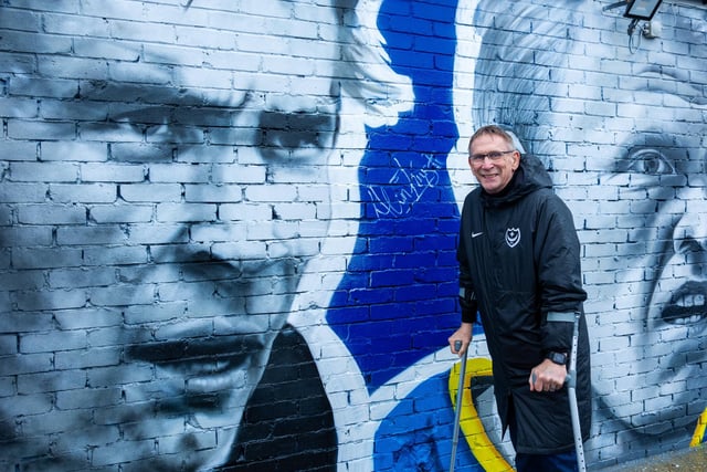 Alan Knight stands next to his picture on the mural which is on the side of the Pompey club shop on Anson Road.