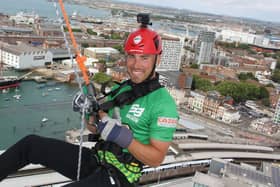 Southern Brave batter Joe Weatherley prepares for his 100m abseil down the Spinnaker Tower.