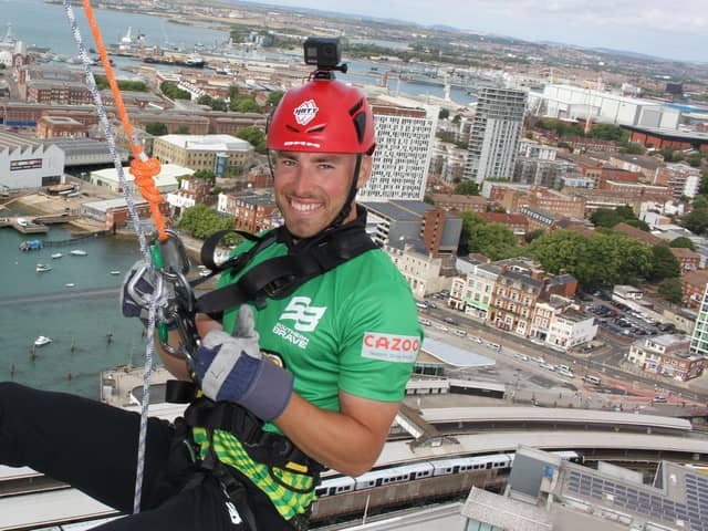 Southern Brave batter Joe Weatherley prepares for his 100m abseil down the Spinnaker Tower.