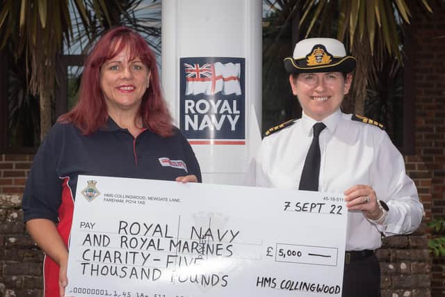 Hillary Jukes from the RNRMC receives a cheque for £5000 from Capt Catherine Jordan, OC HMS Collingwood. The money was raised during the establishment’s recent open day which includes the Brickwood’s field gun competition.