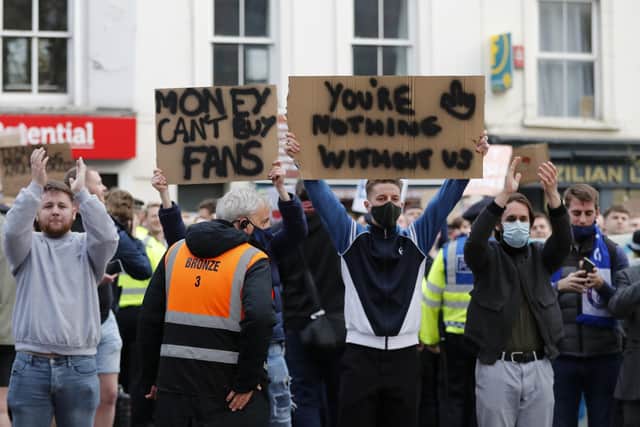 Chelsea fans protest against the proposed European Super League at Stamford Bridge last night - the Blues announced they were withdrawing from it shortly after. Photo by Frank Augstein - Pool/Getty Images.