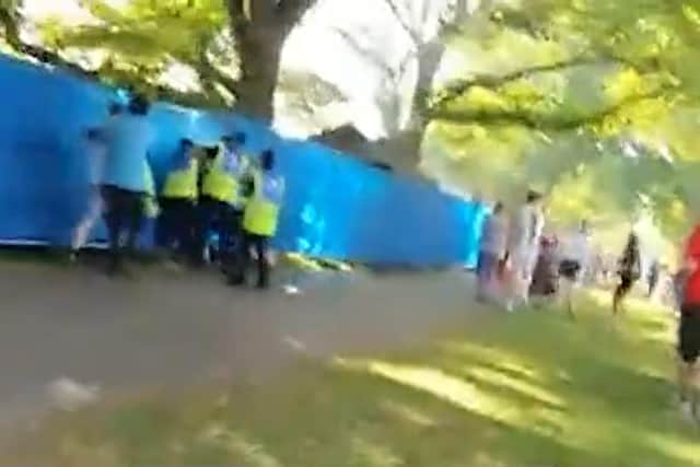 Video footage captured a volunteer putting a man in an armlock before others joined in the fight.