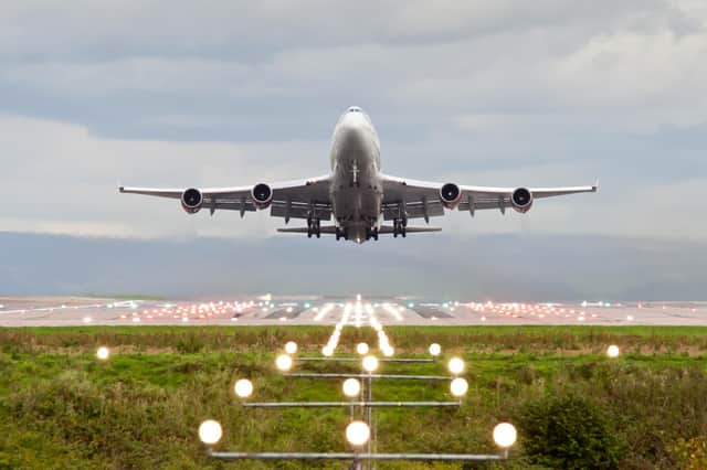 Plane takes off from Manchester Airport.