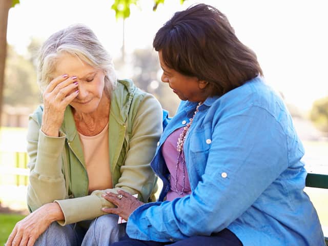 A generic stock photo of a woman comforting a grieving friend. See PA Feature ADVICE Ask Fiona. Picture credit should read: Alamy/PA. WARNING: This picture must only be used to accompany PA Feature ADVICE Ask Fiona.