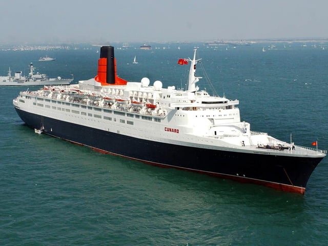 The QE2 in the Solent Tuesday June 28, 2005, where vessels from a massive gathering of the world's navies have anchored at Spithead off Portsmouth, for the International Fleet Review which will be carried out by Queen Elizabeth II from HMS Endurance. As well as warships, the gathered vessels include tall ships, lifeboats, cruise liners and representatives from all sectors of the maritime industry. See PA story SEA Trafalgar. PRESS ASSOCIATION Photo. Photo credit should read: Chris Young / PA.