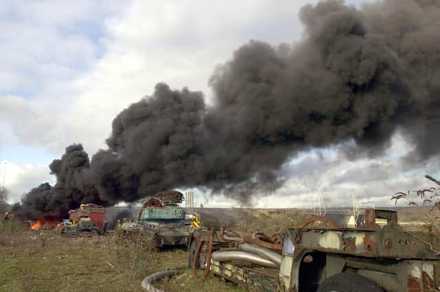 January 3, 2005, and a fire at the entrance to Pound' s scrap yard at Tipner,  Portsmouth. Police had to close the M275 because of the smoke. 
Picture: Malcolm Wells ( 050020-139 )