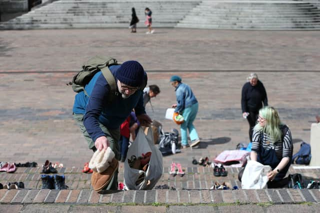 Extinction Rebellion supporters place 95 pairs of shoes on the steps of the Civic Offices in Portsmouth
Picture: Chris Moorhouse   (290820-02)