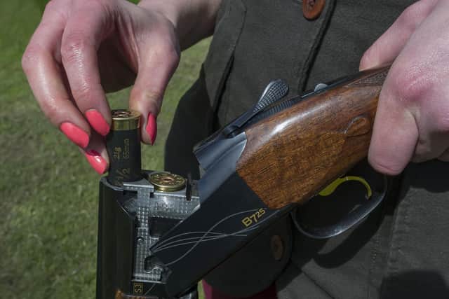 A person is pictured loading a shotgun. It comes as eight guns - including seven shotguns - were reported stolen or lost in Hampshire over the past year.