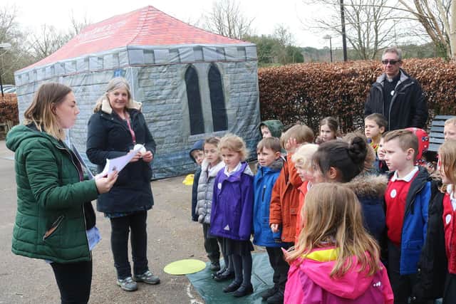 Cathedral staff Eve Davenport, left, and Sarah Page with the rector of Liss, the Rev Chris Williams, and schoolchildren visit8ing the pop-up cathedral. Picture: Portsmouth Diocese