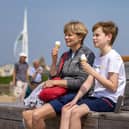 Portsmouth was greeted with glorious hot weather this weekend. Pictured are enjoying the traditional summer diet in Old Portsmouth. Picture: Mike Cooter (110524)