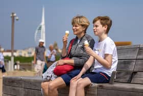 Portsmouth was greeted with glorious hot weather this weekend. Pictured are enjoying the traditional summer diet in Old Portsmouth. Picture: Mike Cooter (110524)