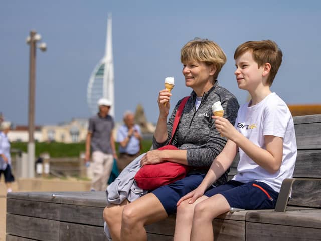 Portsmouth was greeted with glorious hot weather this weekend. Pictured are enjoying the traditional summer diet in Old Portsmouth. Picture: Mike Cooter (110524)