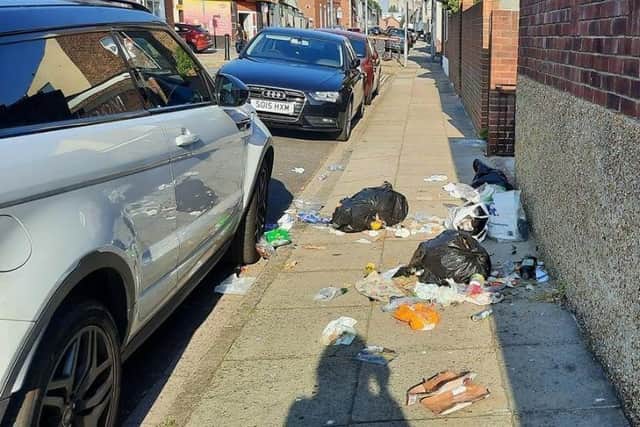 Pictures shared to the city council of broken bin bag litter in the street
